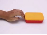 an object pushed on a table stops after sliding a distance